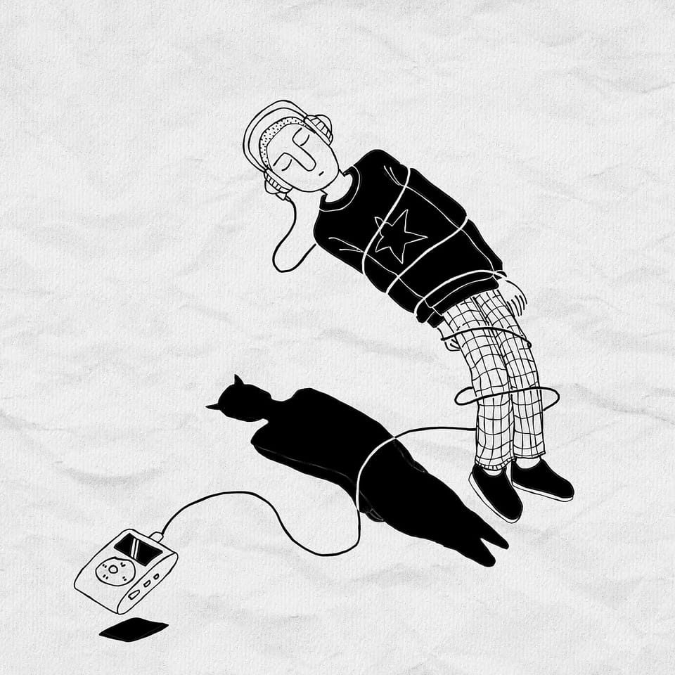 Un homme écoute de la musique enchaîné à son iPod